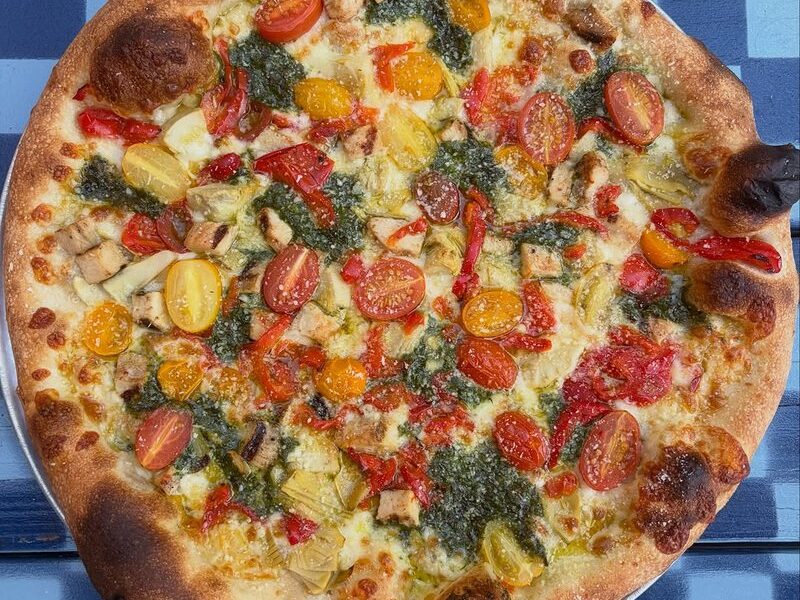 The Michelangelo pizza with pesto, grilled chicken, tomato and artichoke