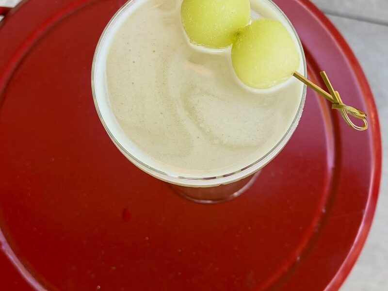 The Honey U Want These Melons cocktail with honeydew melon balls